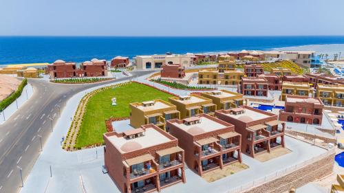 a rendering of a resort with the ocean in the background at Pickalbatros Vita Resort - Portofino Marsa Alam in Abu Dabab
