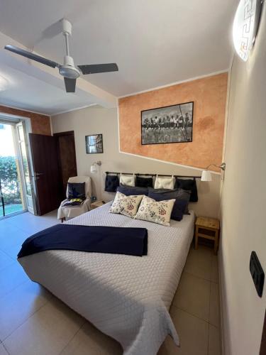 a bedroom with a large bed in a room at Guest House Elisabeth in Pinerolo