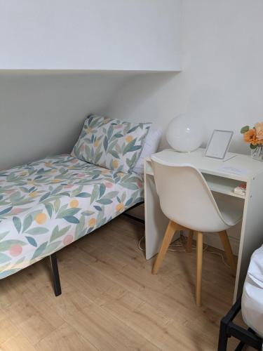 a bedroom with a bed and a desk with a laptop at Relaxing Stay in Craigavon at Power-Quinn English in Craigavon