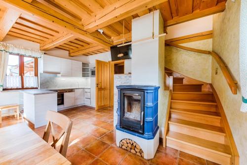 a kitchen with a staircase and a stove at Valašský dvůr in Velké Karlovice