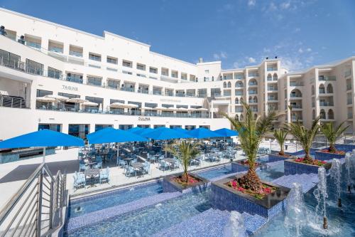 a view of the hotel from the pool at the resort at Pickalbatros Palais Des Roses - Agadir - All Inclusive in Agadir