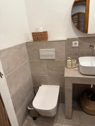 a bathroom with a toilet and a sink at Estudio 1 Café Bernal in Tarifa