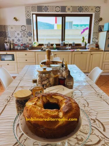 uma mesa com um grande pão em B&B Il Mare di Terrasini em Terrasini
