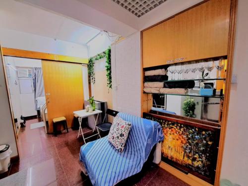 a room with a couch and a table in a room at Cozy full Apartment 2 bedroom central area in Hong Kong