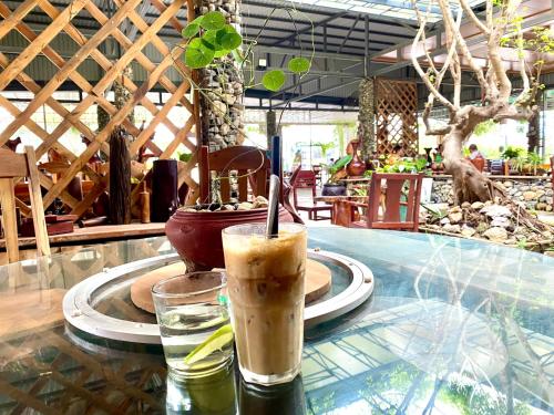 a drink sitting on top of a table at An Bình Home in Ha Tien