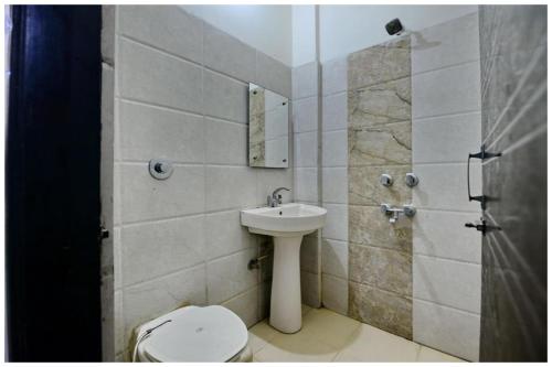 a bathroom with a toilet and a sink at Amritsar Hotel R-A-M-N-E-E-K Near Bus Stand - Spacious Rooms With Free Wi-fi - Restaurant# Parking & Excellent Customer Service - Best Location In Amritsar in Amritsar