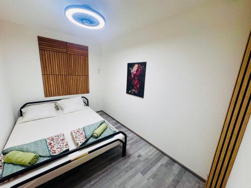 Ένα ή περισσότερα κρεβάτια σε δωμάτιο στο Villa Lakeview Appartment Tomori