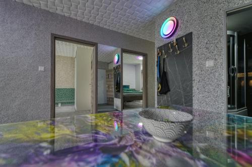 a room with a glass table and a mirror at Magic experience 2 bedroom 70 m2 apartment in Tatranska Lomnica by Gavrieli in Vysoké Tatry