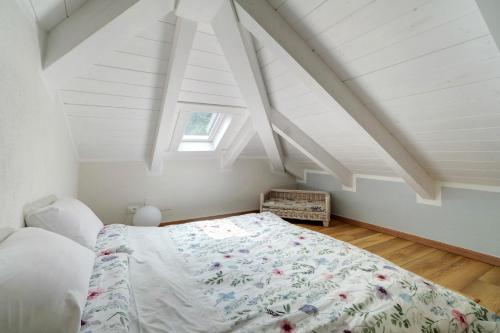 a bedroom with a bed in a attic at Cà Du Praettu in Albisola Superiore