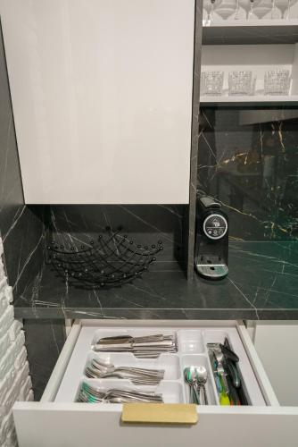 a drawer filled with utensils in a kitchen at Magic experience 2 bedroom 70 m2 apartment in Tatranska Lomnica by Gavrieli in Vysoké Tatry