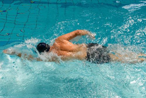 a man in the water in a swimming pool at Castlerosse Park Resort in Killarney