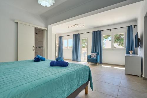 Ένα ή περισσότερα κρεβάτια σε δωμάτιο στο Villa Guadi