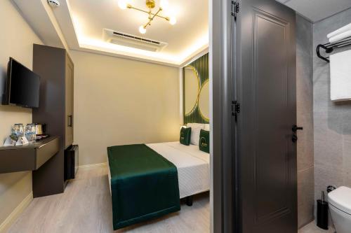 a small room with a bed and a bathroom at Sistina Old City Hotel in Istanbul