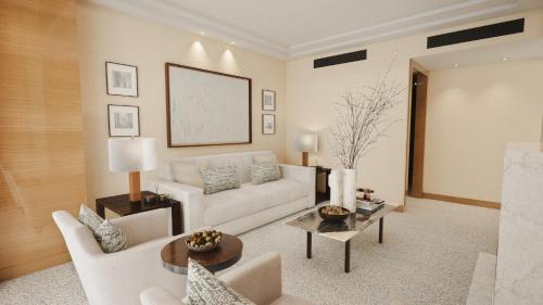 a living room with a white couch and a table at Four Seasons Hotel London at Park Lane in London