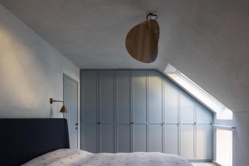 a bedroom with a bed and a large window at Stylish Dublin Coastal Home As Seen on TV in Donabate