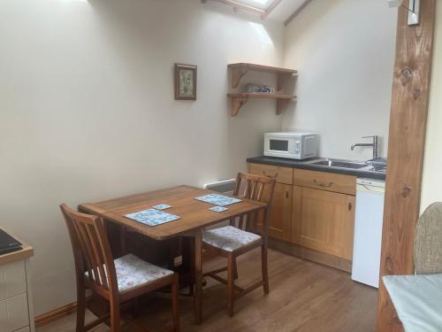 Køkken eller tekøkken på Holly cottage