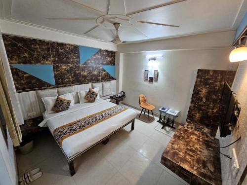 a hotel room with a bed and a television at Hotel Opera Near YASHOBHOOMI & AIRPORT in New Delhi