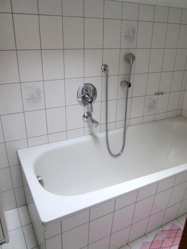 a shower in a bathroom with a white tub at Haus Öfenbichl Ferienwohnungen in Ramsau