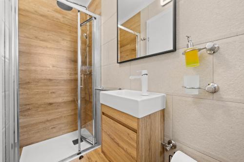 a bathroom with a sink and a shower at Villa Hera with Private Pool in Istria Quiet Location and Modern Design in Orbanići