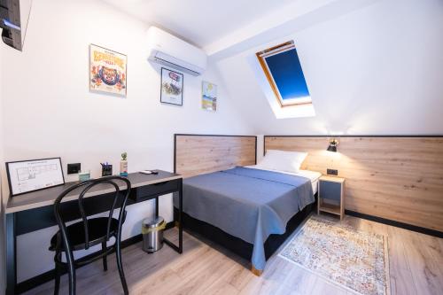 Ένα ή περισσότερα κρεβάτια σε δωμάτιο στο Hoppy rooms - Self Check ln