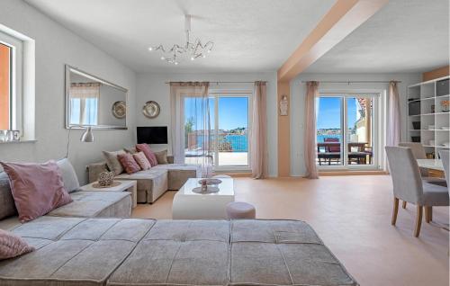 a living room with a couch and a table at 2 Bedroom Nice Apartment In Brodarica in Brodarica