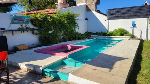 a swimming pool in the backyard of a house at Casa con piscina y jacuzzi en santa clara del mar in Santa Clara del Mar