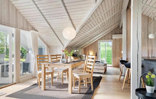 a dining room with a table and chairs at Awesome Home In Hejls With Wifi in Hejls