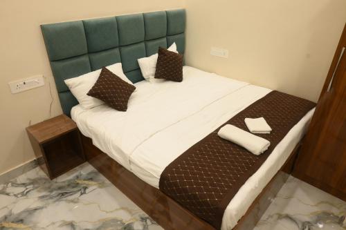 Ένα ή περισσότερα κρεβάτια σε δωμάτιο στο Shree Hari Niwas P Guest House