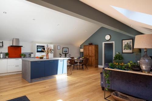 a large kitchen and living room with a table at Bowland Lodges in Lancaster