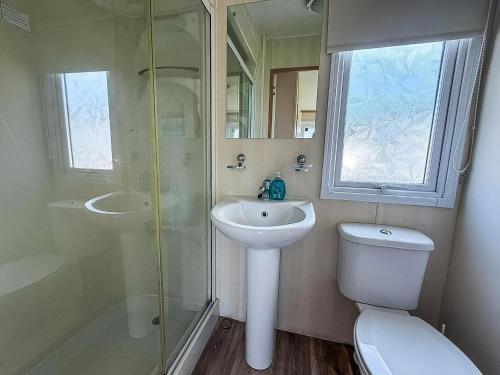 a bathroom with a sink and a toilet and a shower at Lovely 6 Berth Caravan For Hire At Manor Park In Hunstanton Norfolk Ref 23044S in Hunstanton