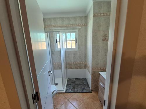 a bathroom with a shower and a toilet at UF holiday Villa in Málaga