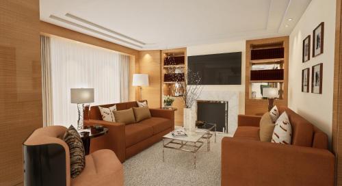 a living room with two couches and a fireplace at Four Seasons Hotel London at Park Lane in London