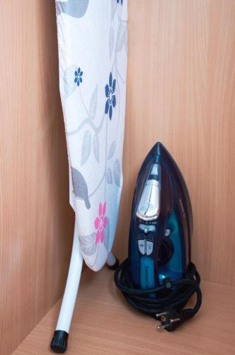 a toy pen and a toy bat next to a curtain at Apartamenty Tercet, Apartament Kwartet, Apartament DUO in Ustka