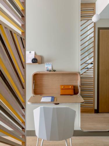 an office with a desk and a chair at OKKO Hotels Troyes Centre in Troyes