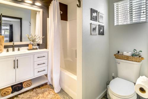 a bathroom with a shower and a toilet and a sink at Walk to Trails Modern Munds Park Mountain Retreat in Munds Park