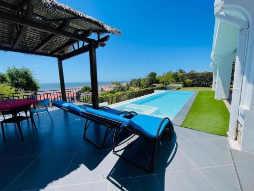a pool with a slide on a house at RESIDENCE SAPHIR in Mahajanga