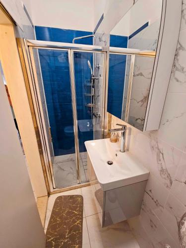 a bathroom with a sink and a shower at Apartment Nemo in Jesenice