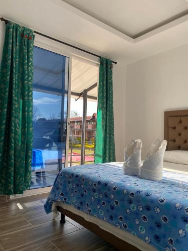 Postel nebo postele na pokoji v ubytování Hotel Mirador de Curiti