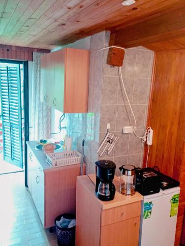 a kitchen with a washer and dryer in a room at Apartments with balcony and with large free parking House Oliver in Plitvička Jezera
