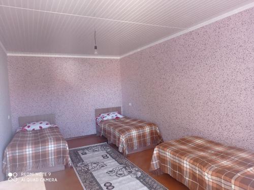 Ένα ή περισσότερα κρεβάτια σε δωμάτιο στο kadzhisaihouse