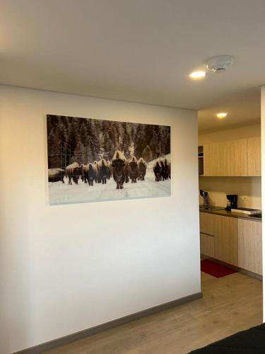 a painting of cattle on a wall in a kitchen at Roger USAQUEN 120 in Bogotá