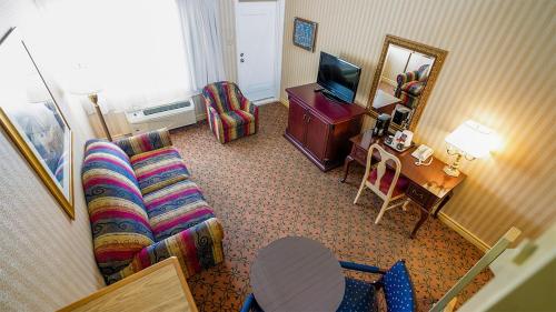 Télévision ou salle de divertissement dans l'établissement Auberge Québec