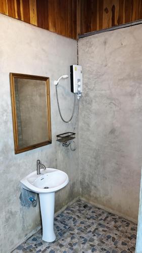 a bathroom with a sink and a mirror at Sea Paradise Klongkoi beach in Ban Khlong Kloi