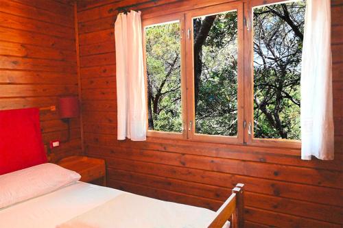 Katil atau katil-katil dalam bilik di Camping Porto Sosàlinos