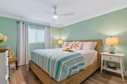 a bedroom with a bed and a window at Crescent Royale 105 in Siesta Key
