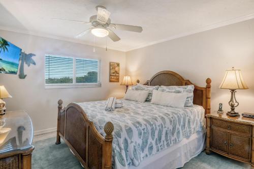 a bedroom with a bed and a ceiling fan at Crescent Royale Condominiums 205 in Siesta Key