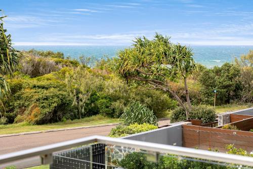 a view from the balcony of a house at Seaside Luxury: Private Pool and Stunning Views in Yaroomba