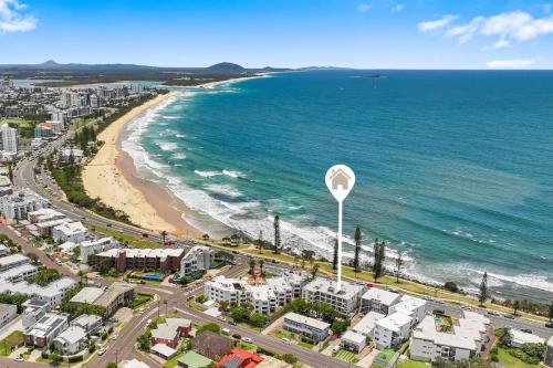 an aerial view of a city and the beach at Amalfi on Alex: Seaside 2 Bedroom Retreat in Alexandra Headland