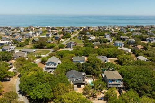 an aerial view of a neighborhood with houses and the ocean at Oceanside retreat with pool & spa June Weeks Open in Sanderling