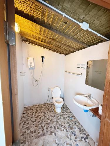 a bathroom with a toilet and a sink at Sea Paradise Klongkoi beach in Ban Khlong Kloi